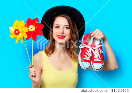 Woman with pinwheels and gumshoes Woman with pinwheels and gumshoes 31321455