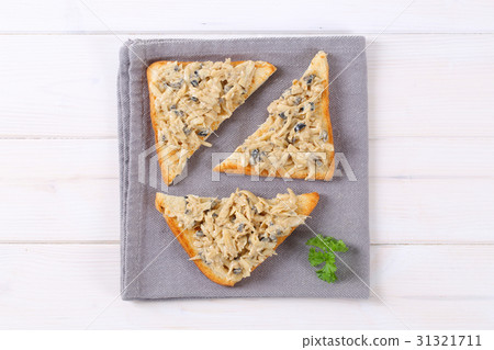 toast with grated cheese and olive spread 31321711
