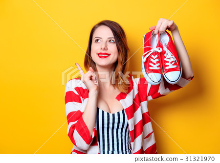 Woman with red gumshoes 31321970