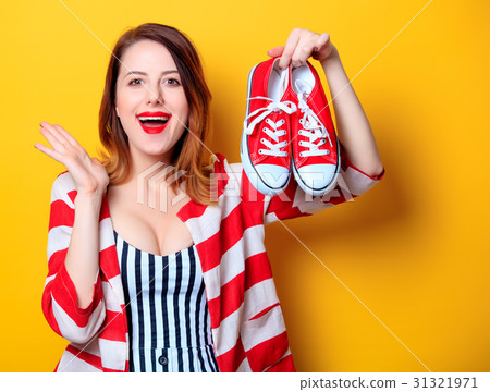 Woman with red gumshoes 31321971