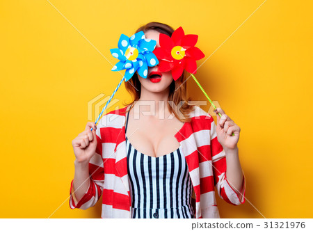 Woman with pinwheel toy Woman with pinwheel toy 31321976