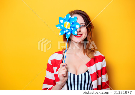 Woman with pinwheel toy Woman with pinwheel toy 31321977