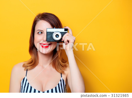 Smiling woman with camera Smiling woman with camera 31321985