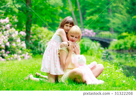 Young mother and little gith have a rest Young mother and little gith have a rest 31322208