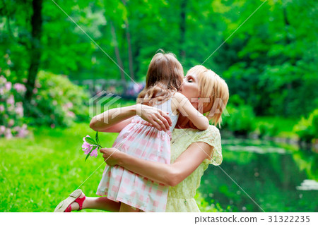 Young mother and little gith have a rest Young mother and little gith have a rest 31322235