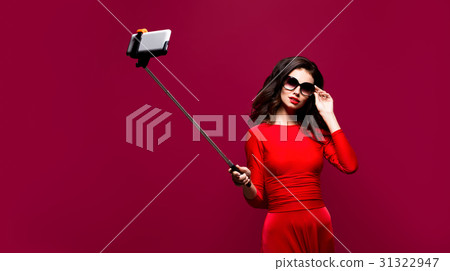 Portrait of beautiful brunette in awesome dress 31322947