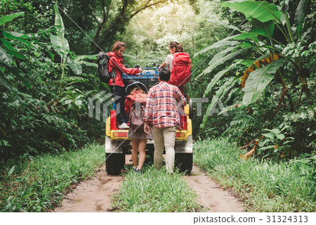Happy asian young travellers with car off road Happy asian young travellers with car off road 31324313