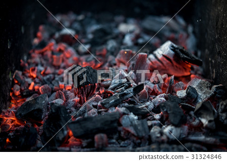 Smouldering coals at barbeque campfire 31324846