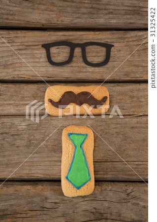Cookies with mustache and tie shape decoration  31325422