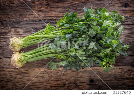 Fresh celery root with leaf on rustic oak table. 31327640