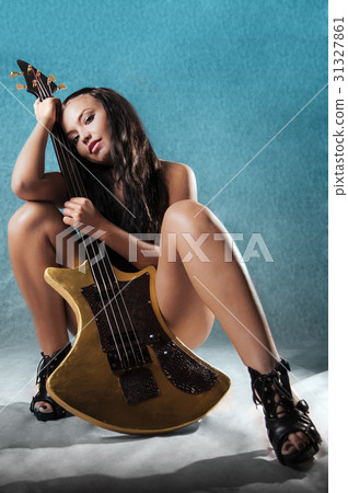 Sexy woman with guitar 31327861