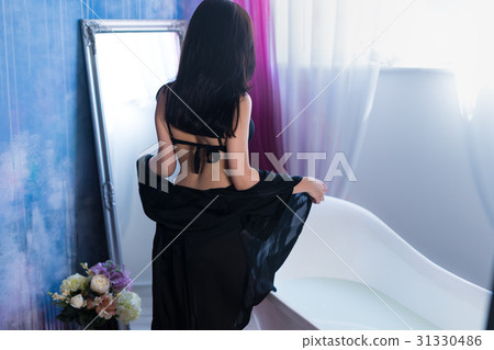Sexy brunette woman taking off her clothes before - Stock Photo [31330486] 