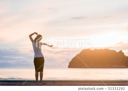 Relaxed woman breathing fresh air at on the beach. Relaxed woman breathing fresh air at on the beach. 31331292