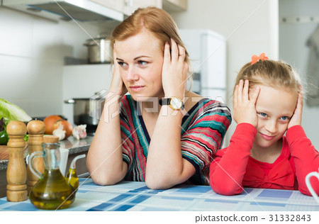 Ordinary frustrated mom scolding little daughter Ordinary frustrated mom scolding little daughter 31332843