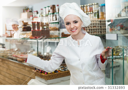 Female staff greeting clients in local confectionery 31332893