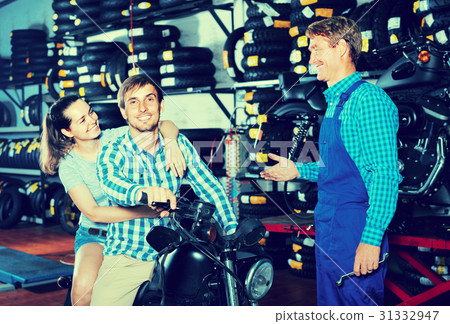 couple sitting on motorcycle 31332947