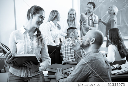 Teacher and happy adult students 31333973