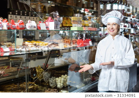 Mature woman selling chocolates 31334091