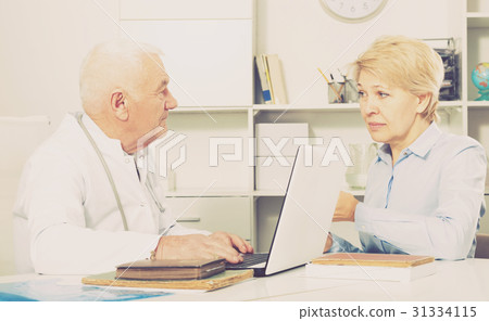 Woman on consultation with doctor Woman on consultation with doctor 31334115