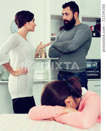 Father and mother having disagreement 31334168