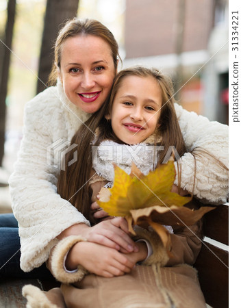 Positive woman with little girl 31334221