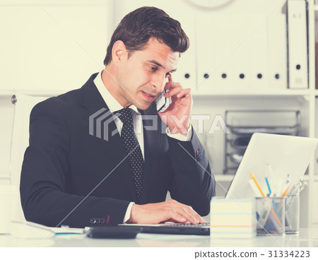Businessman having phone call Businessman having phone call 31334223