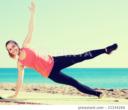 woman working out in beach 31334268