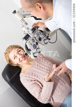 Checking eyesight in clinic. 31334404