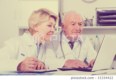 Doctor and nurse in office 31334422