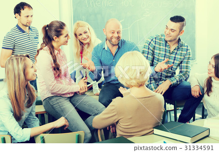 Professor consulting different age students Professor consulting different age students 31334591