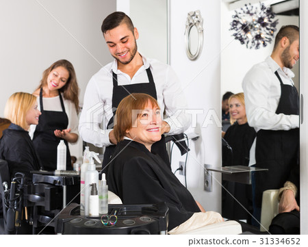 Mature woman in the barbershop. Mature woman in the barbershop. 31334652