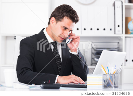 Businessman having phone call 31334656
