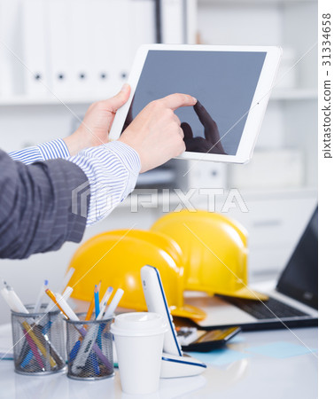 Woman using touchscreen tablet Woman using touchscreen tablet 31334658