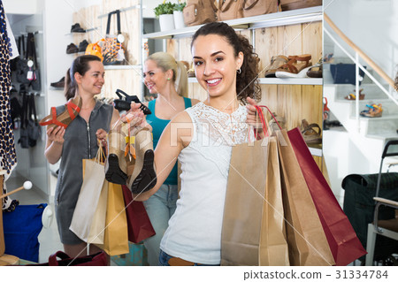 girl showing a chosen pair of shoes 31334784