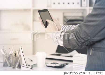 Businesswoman using smartphone 31334795