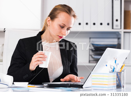 Young female drinking water Young female drinking water 31335180