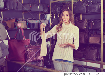 Portrait of woman selling wallets and purses 31335210