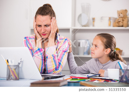 Portrait of sad female with little schoolgirl Portrait of sad female with little schoolgirl 31335550