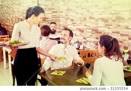 Waitress taking table order at tavern Waitress taking table order at tavern 31335554