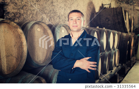 Man checking ageing barrel process 31335564