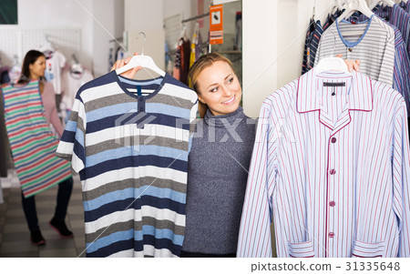 Girl shopping sleepwear for man 31335648