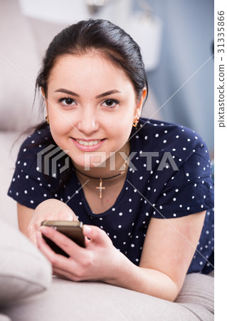 Cheerful girl with mobile phone Cheerful girl with mobile phone 31335866