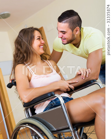 Smiling couple with disabled spouse 31335874