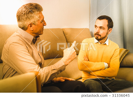 Adult father and son solve problems Adult father and son solve problems 31336045