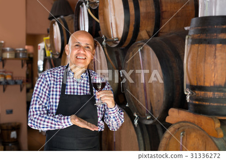 man holding wine in wine house man holding wine in wine house 31336272