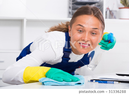 female cleaner with duster 31336288