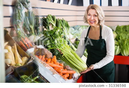 Portrait of senior woman working in grocery Portrait of senior woman working in grocery 31336598
