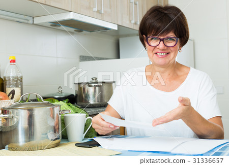 happy woman paying bills happy woman paying bills 31336657