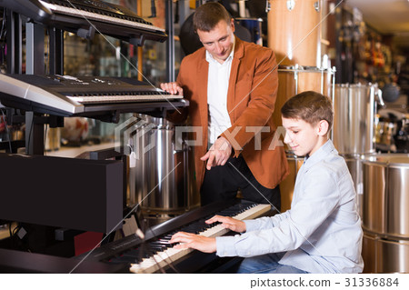 Salesman offers to play a synthesizer Salesman offers to play a synthesizer 31336884