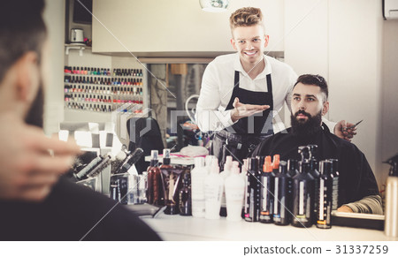 Hairdresser displaying result of work Hairdresser displaying result of work 31337259